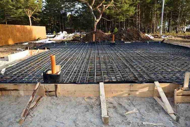 Reinforced concrete slab foundation with steel rebar grid prepared for pouring in Eastlake, OH