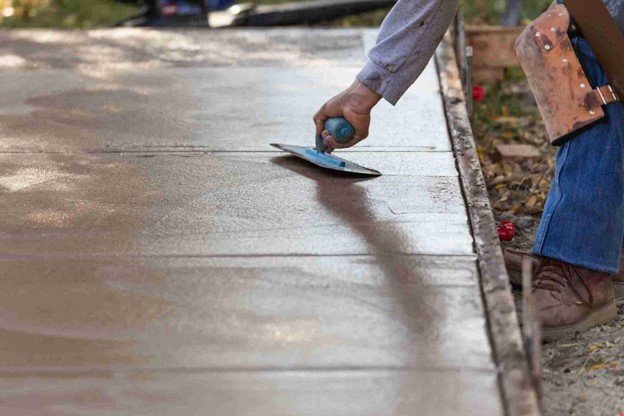 Newly installed concrete driveway with smooth finish and clean layout at residential home in Eastlake, OH